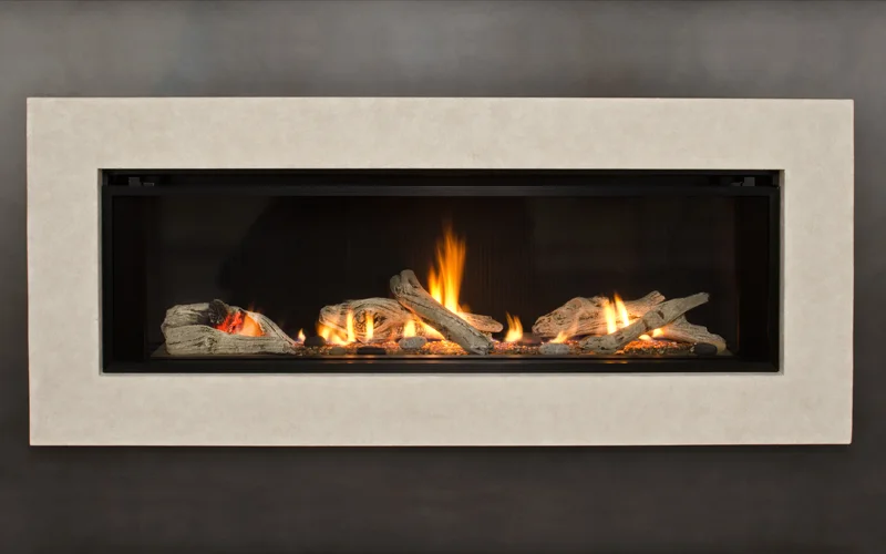 Valor L2 linear gas fireplace with fluted sandstone surround