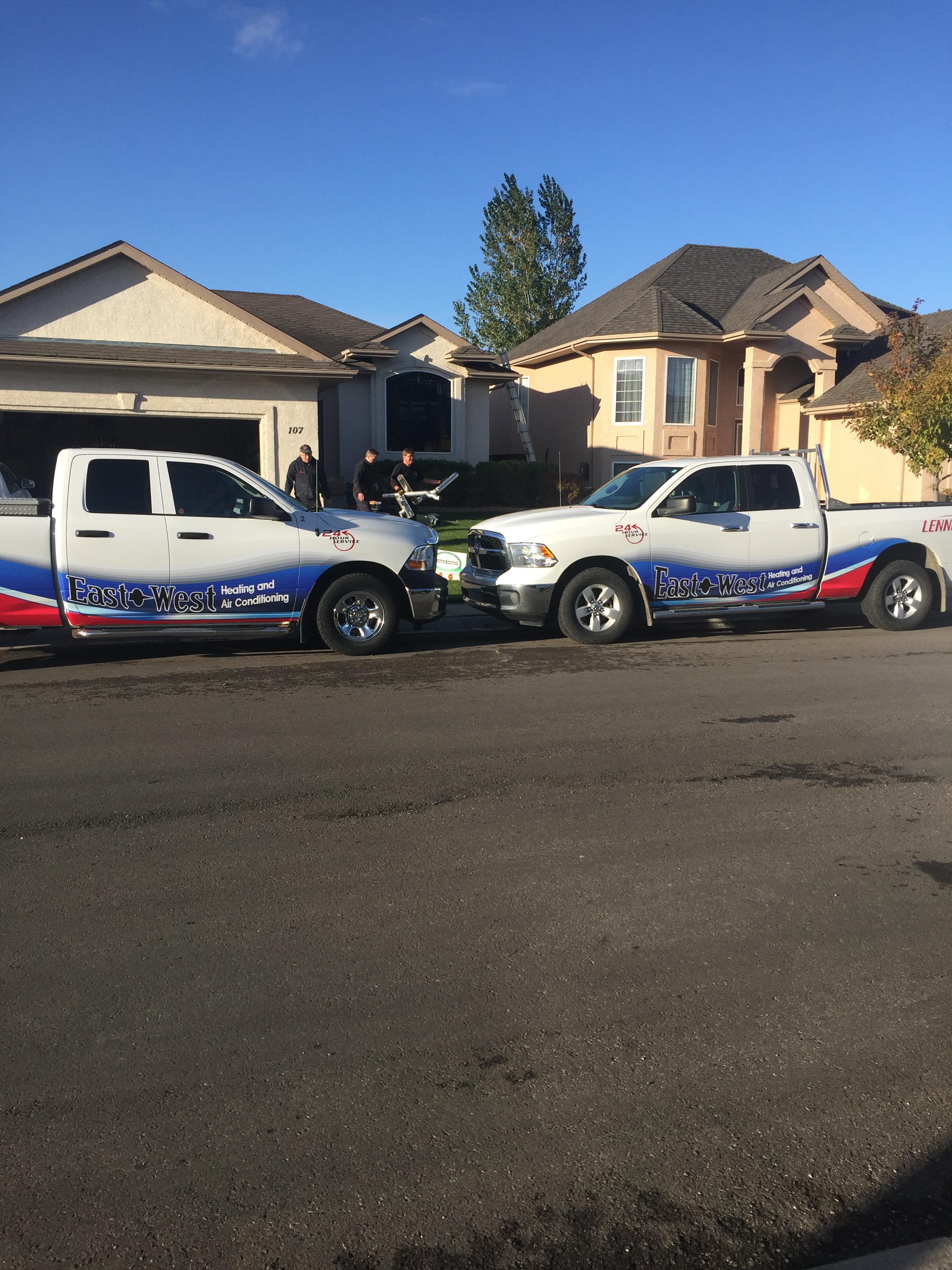The East West Heating team installing a donated Lennox furnace